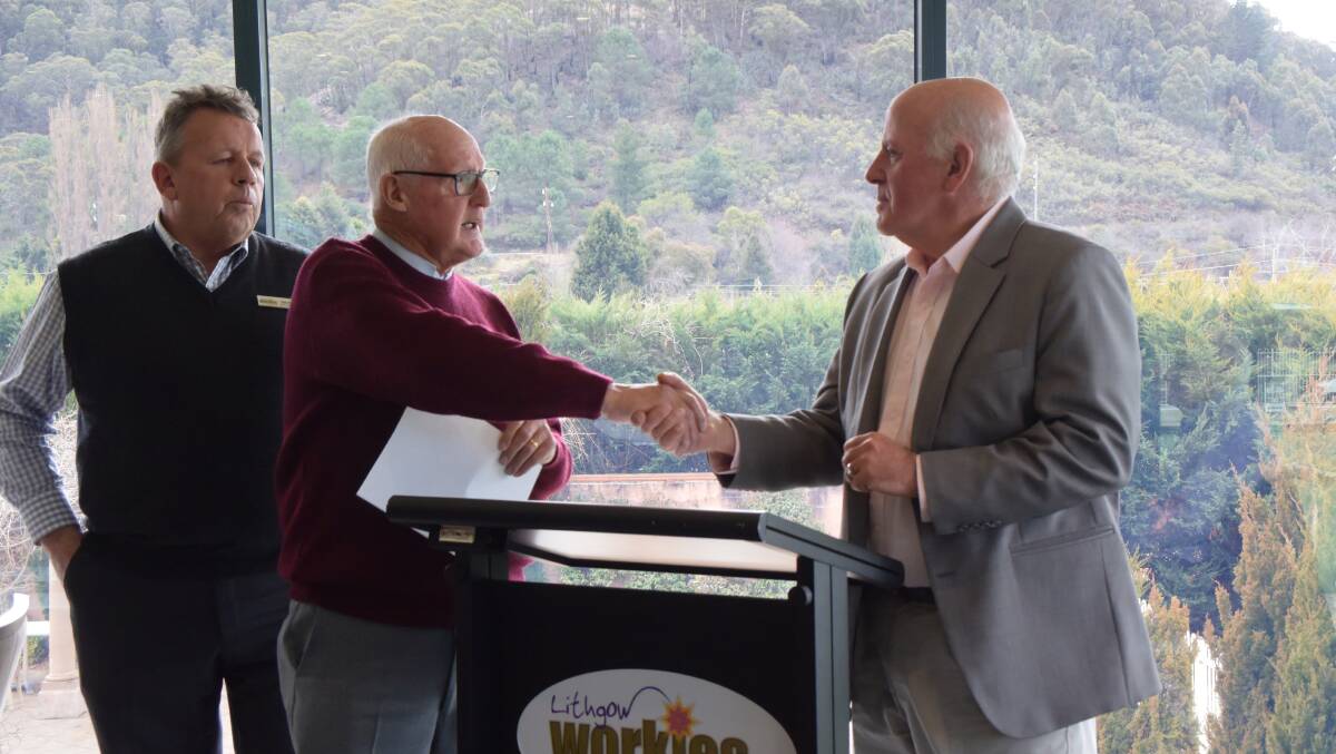 CONGRATULATIONS: Workies president Howard Fisher congratulates Alex Ferguson for ten years in the role of CEO of Lifeline Central West. 