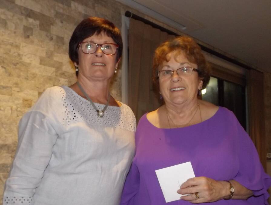 CLUB: Club vice president Rhonda McAndrew with Wendy Dixon who received her badge for 25 years of service. 
