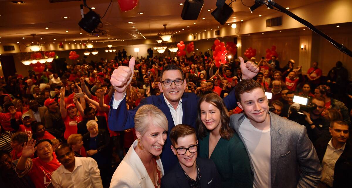 THUMBS UP: Premier Daniel Andrews celebrates with his family after his Victorian Labor government soundly defeated the Coalition in the state election on the weekend. Photo: JOE ARMAO