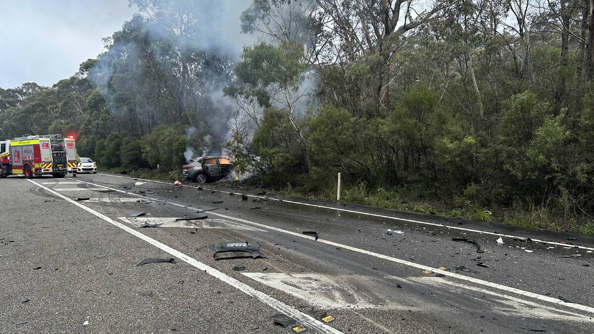 The car on fire on the Great Western Highway near Explorers Road, Katoomba. Picture Michael Paag