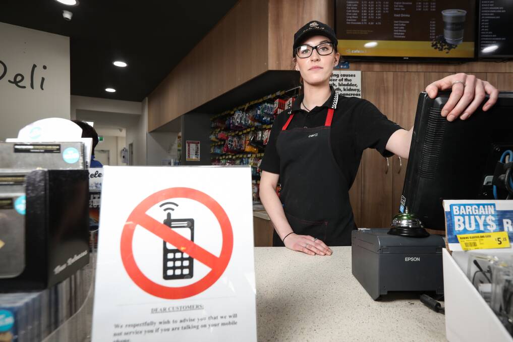 SWITCHED ON: APCO Wodonga barista Darci D’Helin-Lawrie says when customers cannot get off their mobile phones long enough to be served in the store it shows a total lack of respect for the staff. Picture: JAMES WILTSHIRE