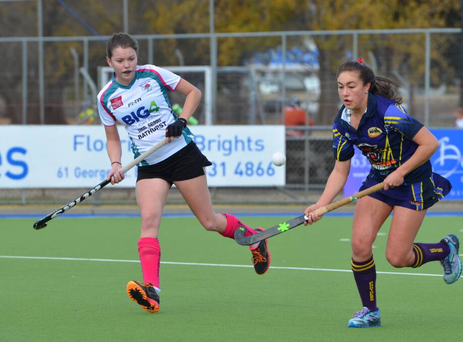 EYE ON THE BALL: Lithgow Panther Hannah Kable, with City's Anna Cartwright chasing, bursts out of defence. Kable scored twice for Panthers, who won the match 4-2. Photo: ANYA WHITELAW