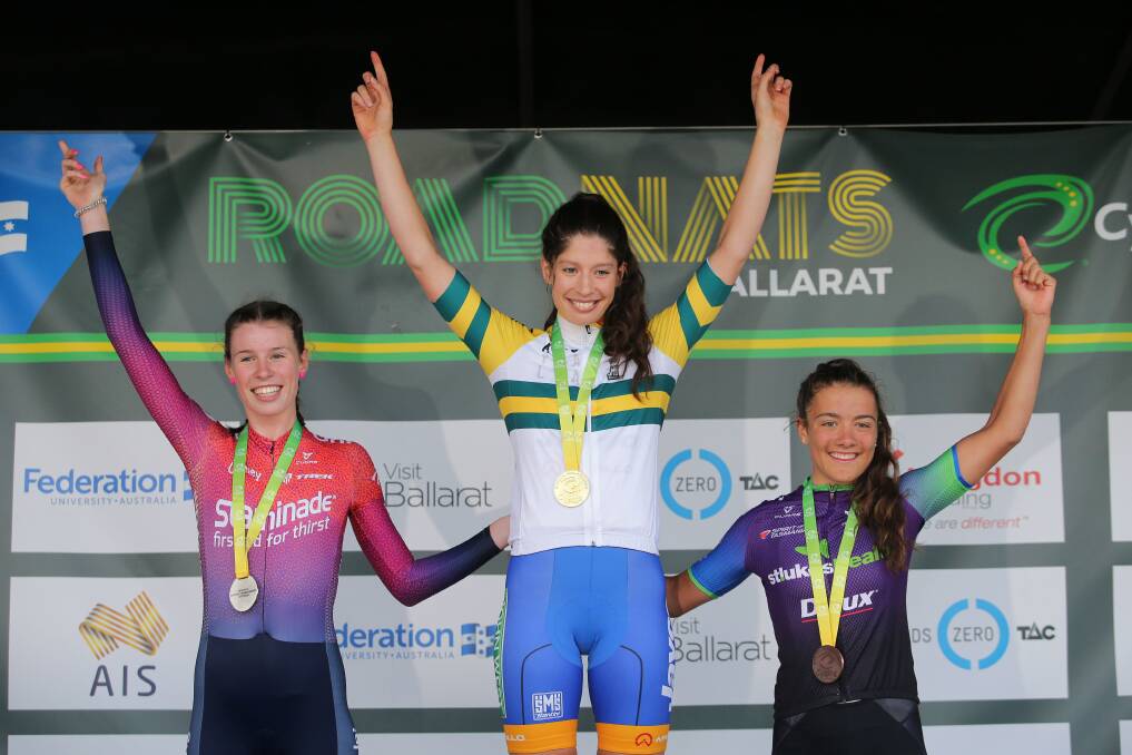 HAPPY MOMENT: Emily Watts (left) enjoys her moment on the under 23s podium after clinching criterium silver. Photo: JOHN VEAGE