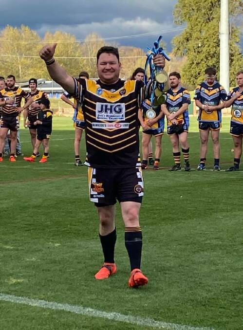PROUD MOMENT: Oberon coach Dallas Booth gives the thumbs up as he holds the Tigers' premiership medals. Photo: OBERON TIGERS