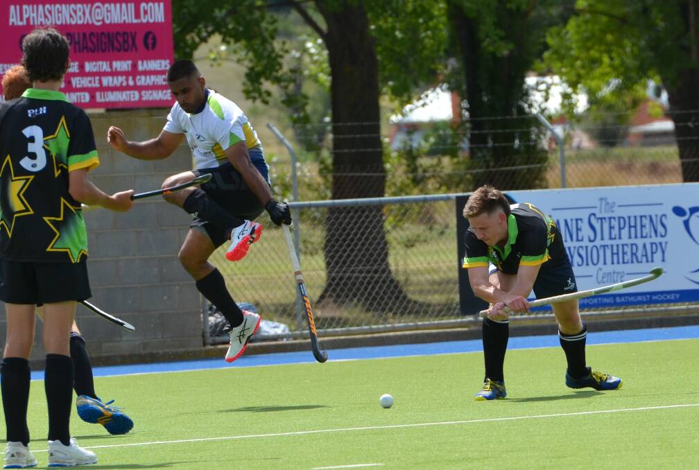 A Northern defender jumps to get out of the way as All Stars player Declan Daley winds up for a tomahawk. Picture by Anya Whitelaw
