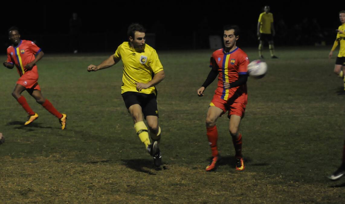 CLEAN SHEET: Mariners defender Nikki Spice clears the ball away from a Dulwich Hill rival on Saturday night, helping the Western outfit to a much needed triumph on home soil at Proctor Park. Photo: CHRIS SEABROOK