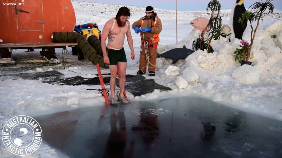 THE BIG FREEZE: Australia's Antarctic program team plunge into the sub-zero ocean to celebrate the winter solstice in 2017. Picture: Daleen Koch, Australian Antarctic Program