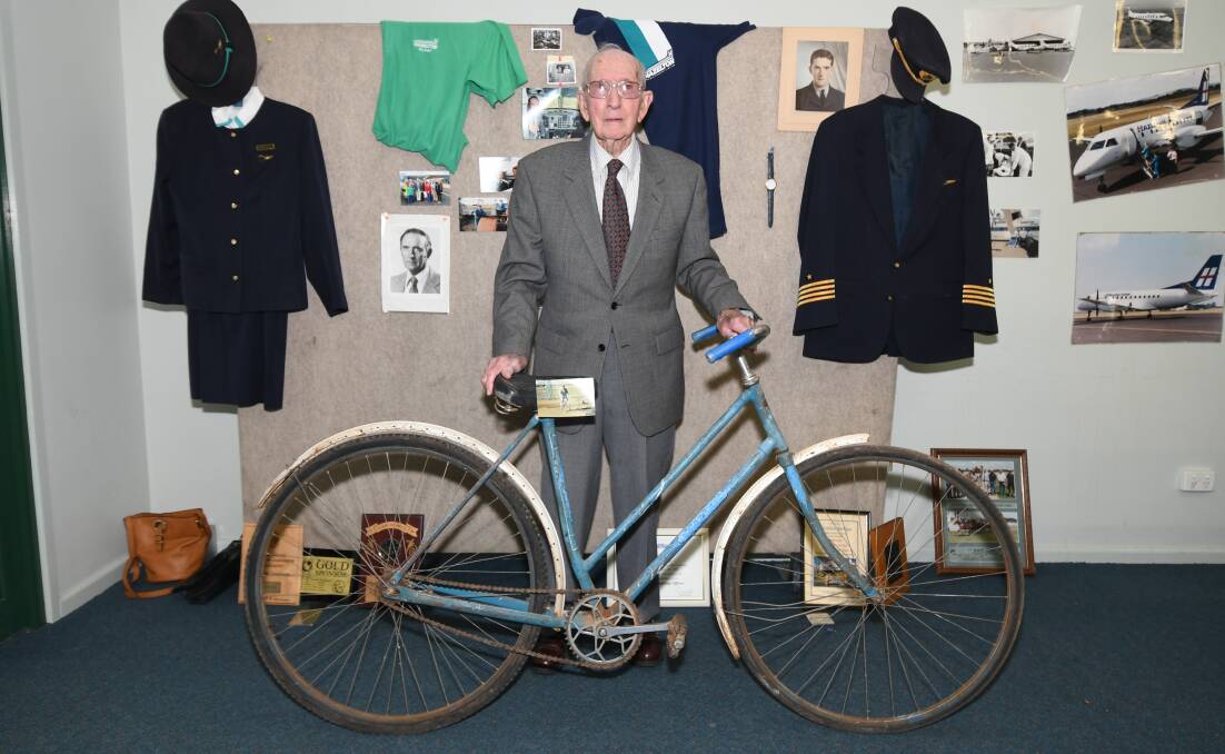 Hazelton Airlines founder Max Hazelton with his old bicycle and memorabilia at Sunday's reunion. Picture by Carla Freedman.