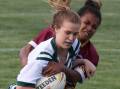 GOT HER: This Riverina defender wraps up Western fullback Sophie Stammers at Wagga on Friday night. 