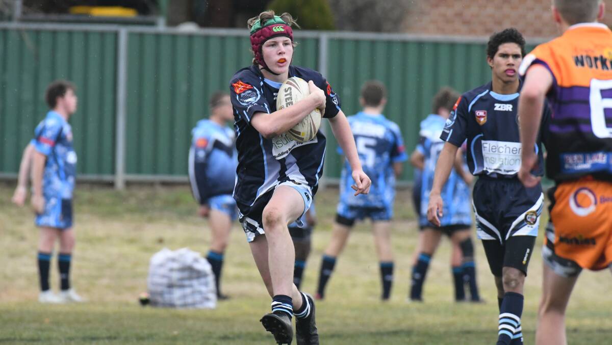 LIKE A TIGER: Jack Aveyard in action for the Bloomfield Tigers under 15s. Photo: JUDE KEOGH