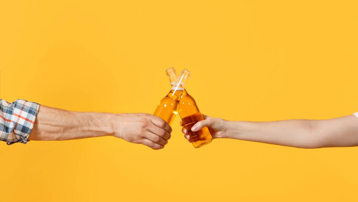Cheers - in a time of COVID-19: Social distancing but celebrating the end of a big week - at home, of course. Photo: Shutterstock