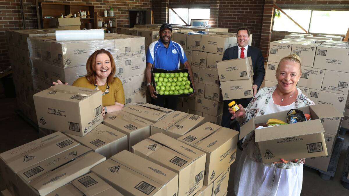 Hope in a crisis: Chaplain John Kewa, Good360 founder Alison Covington, Wollongong MP Paul Scully and Kiama resident Nicole Dillon with some of the 1200 care packages being sent to the Ruby Princess crew. Picture: Robert Peet.