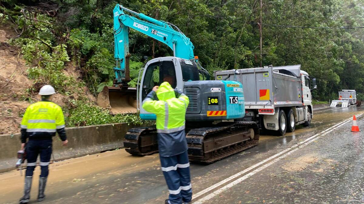CLEAN-UP: Crews work to clean-up fallen trees from the Bells Line of Road late last month. Photo: TRANSPORT FOR NSW