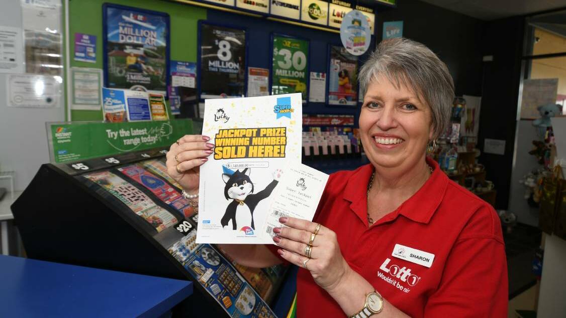 JUST THE TICKET: Trinity News & Gifts over Sharon Bryon got to share the good news with her customer. Photo: CHRIS SEABROOK