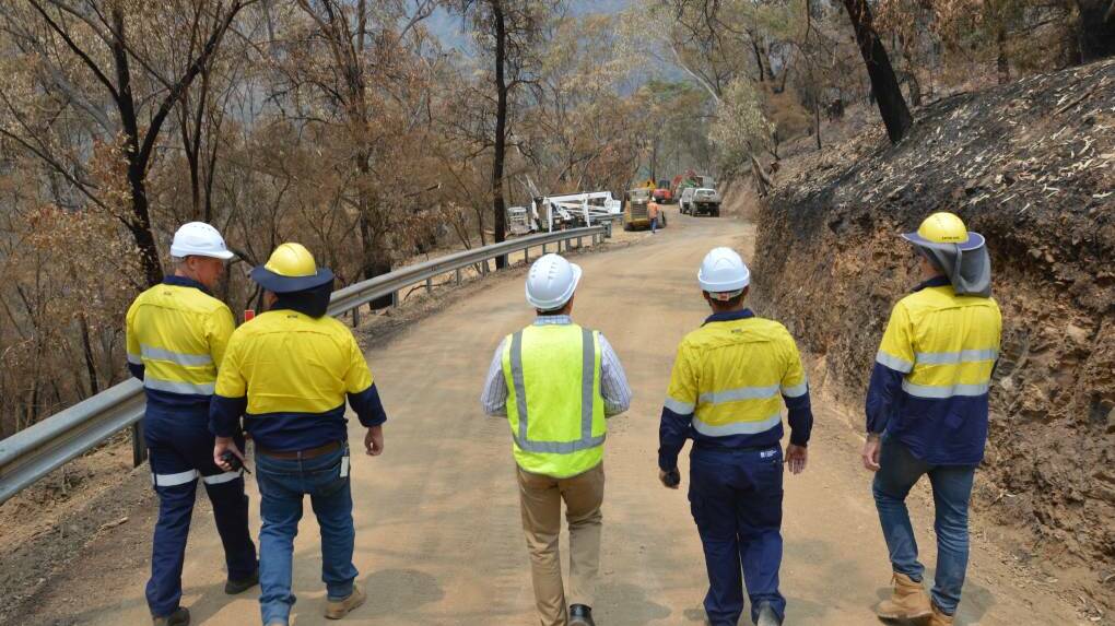 CLEAN-UP: Workers on-site at Jenolan Caves Road last month in the aftermath of the devastating bushfires. Photo: SUPPLIED