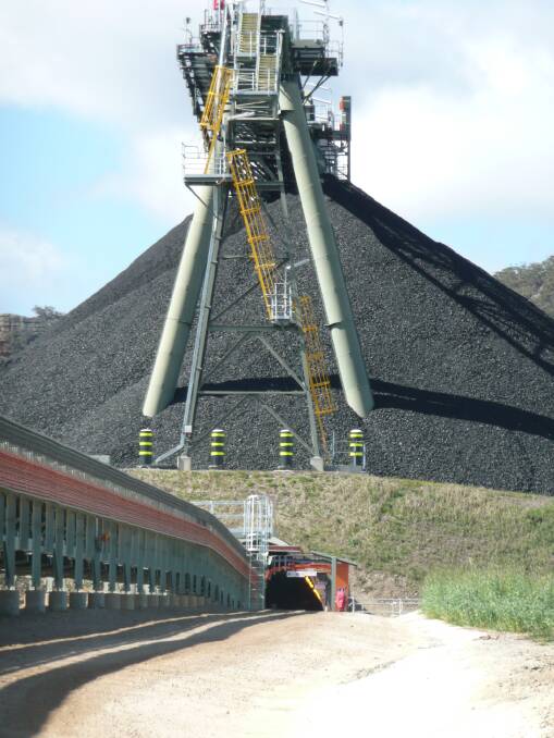 BACK: Since reopening in 2014, Airly mine has been a big boost to Lithgow's economy. Pictured is the coal stockpile, reclaim tunnel and train loading gantry. Photo: Supplied