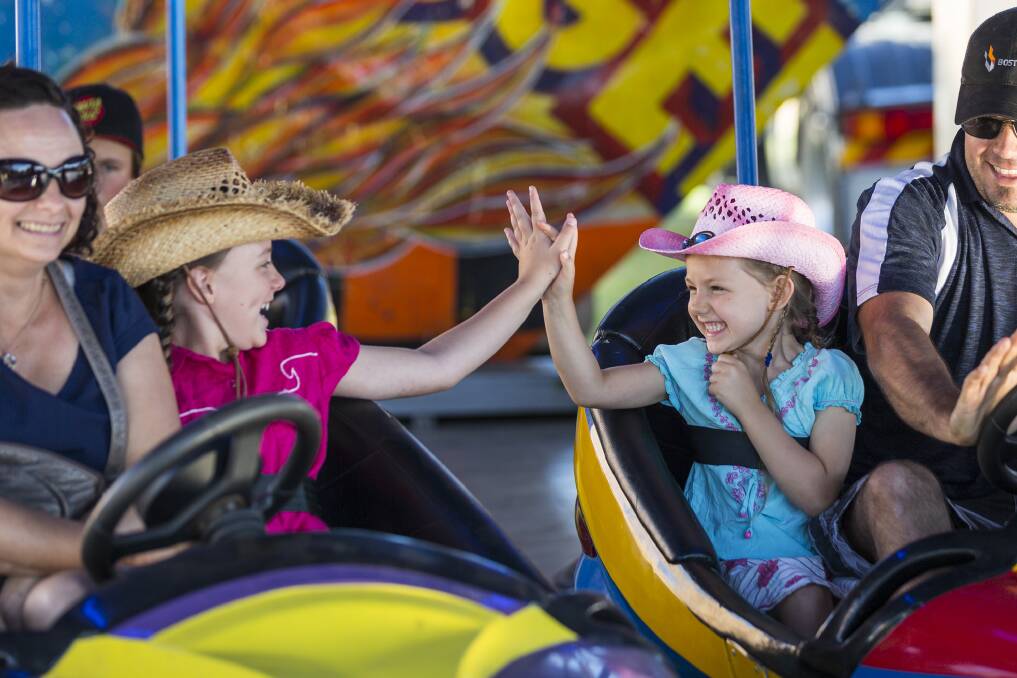 High five: The kids will have a wow of a time once again at this year's show, with rides, show bags and yummy food on offer. Photo: Matt Hudson Photography