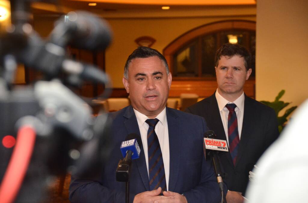 Hanging on his words: NSW Deputy Premier John Barilaro speaks to the media as member for Albury Justin Clancy looks on. Picture: BLAIR THOMSON