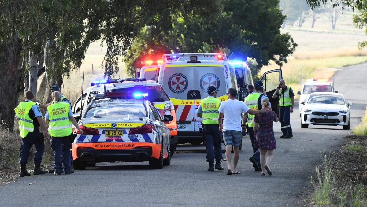 EMERGENCY SERVICES: Police and paramedics at the scene of Tuesday evening's crash. Photo: CHRIS SEABROOK.