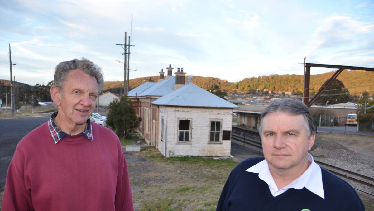 EYESORE: Ron McNair and Michael Wilson of Lithgow State Mine Railway and COC Limited in front of the currently delapidated Eskbank station. Picture: HOSEA LUY
