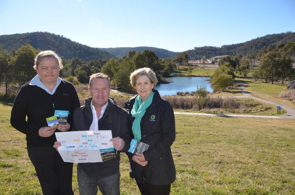 PLACES TO SEE: Lithgow tourism manager Kellie Barrow, Lithgow Commerce Chamber vice-president Mark Hoy and EnergyAustralia's Jennifer Cordina showcasing the new Lithgow tourism maps in front of Lake Pillans.