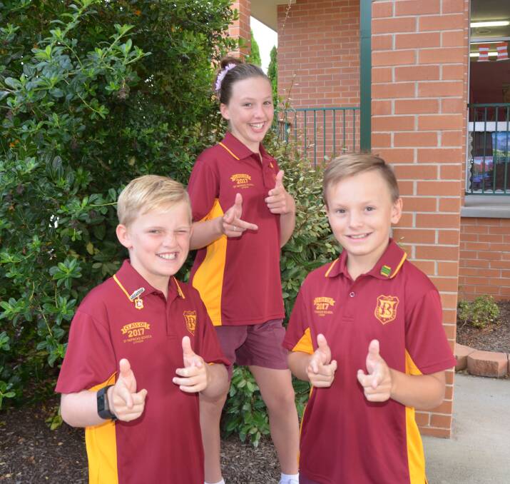 HOT SHOTS: Year six students Eli Morris, Lucy Green and Hutch Evans are thrilled to be playing at PSSA level after qualifying for their Polding teams in very conditions last Friday. Photo: HOSEA LUY