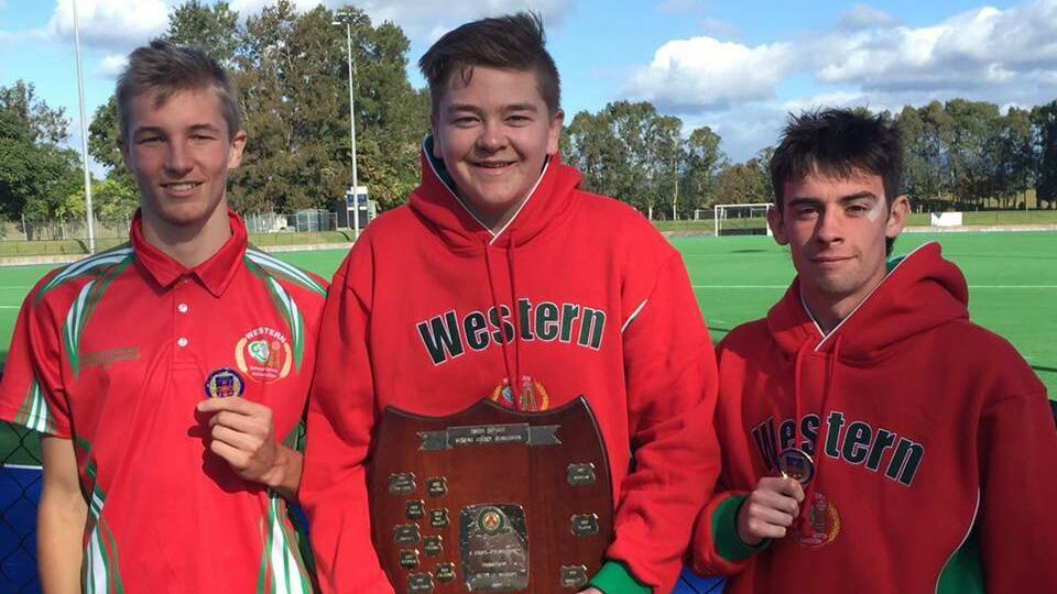 STATE CHAMPIONS: Lithgow High School students Logan Hunter, Mitchell Brain (year 12) and Dane Gaffogg (year 11) proudly displaying the spoils from their win in June. Picture: SUPPLIED