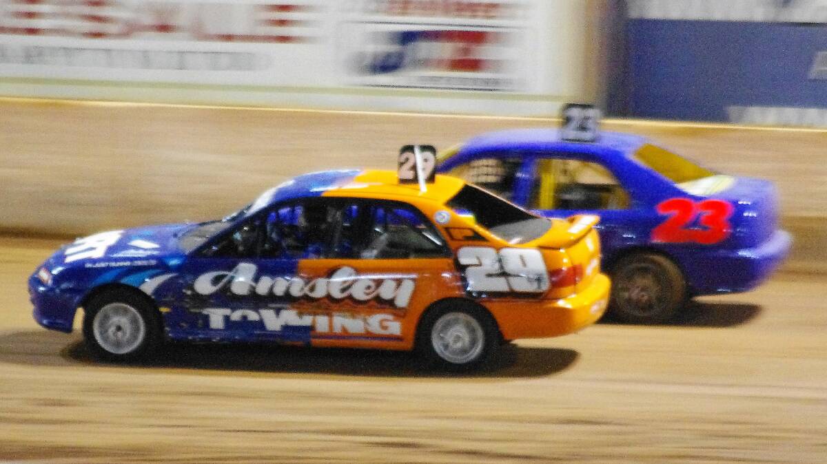 OFF AND RACING: Portland's Jaiden Healey (29) powers past Joshua Weir for second place in the New Star Junior RSA Queensland Championship at Archerfield Speedway in September. Picture: LES TAYLOR 
