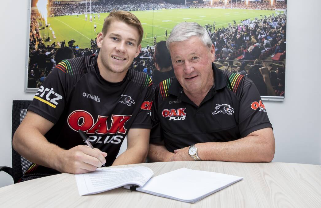 MOVING UP: Matt Burton and Panthers recruitment manager Jim Jones after signing an improved deal with the club earlier this year. Photo: PENRITH PANTHERS