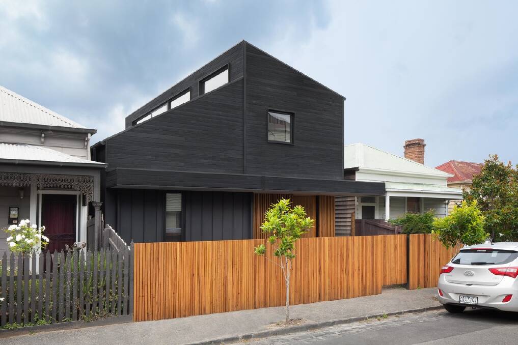 STATEMENT FACADE: Sitting between traditional colonial style homes which are a feature in parts of St Kilda, this client's home makes a bold statement with its black and timber facade. 