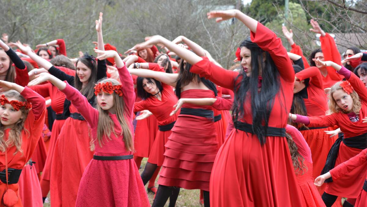 An estimated 200 people recreate the music video for Kate Bush's number 1 hit from 1978, Wuthering Heights, at Woodford Academy. 