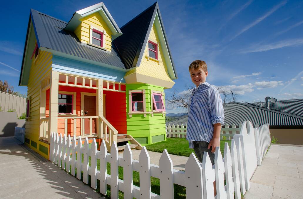Leo Fincher, 7, with a replica of the house from Disney Pixar's Up that his dad, Scott Fincher built. Picture: Elesa Kurtz 