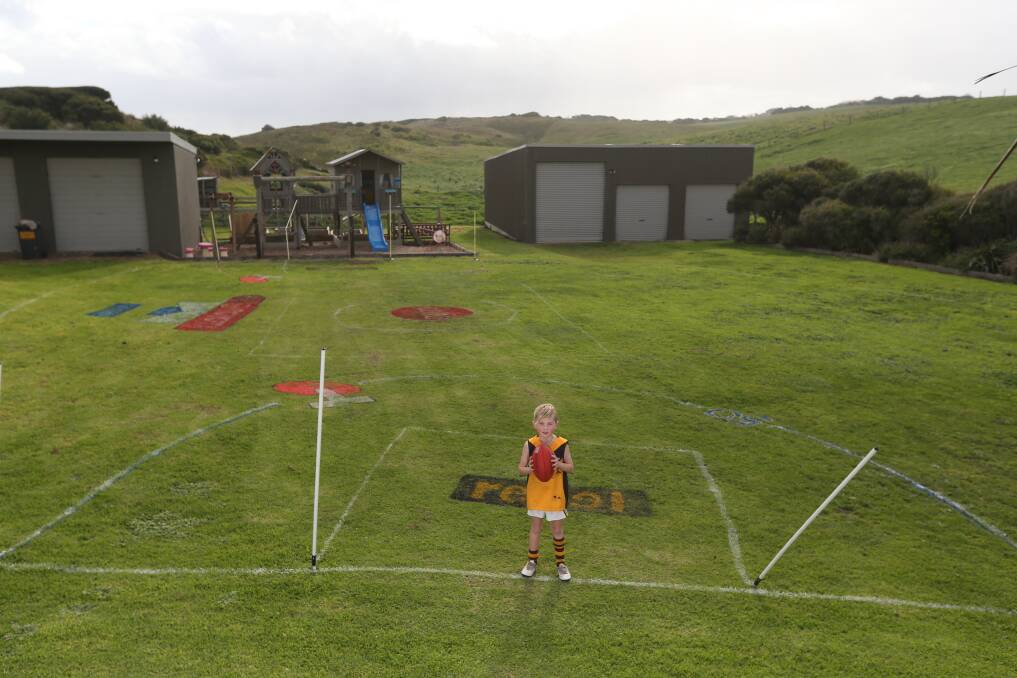 PERFECT PLAYGROUND: Lawson Chow is making the most of home schooling during the COVID-19 restrictions, taking time to play football on his own ground. Picture: Mark Witte 