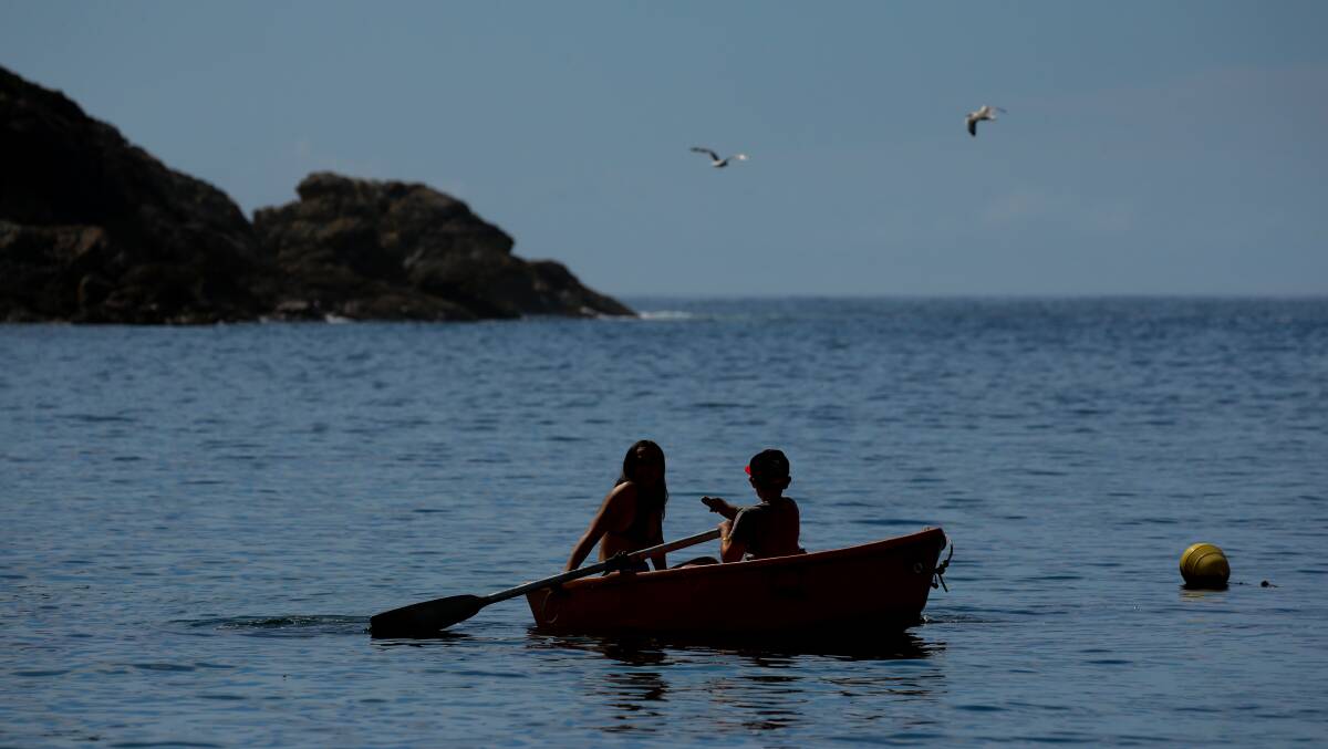 Children rowing on the waters of Esmeralda Cove. Picture: Jonathan Carroll 