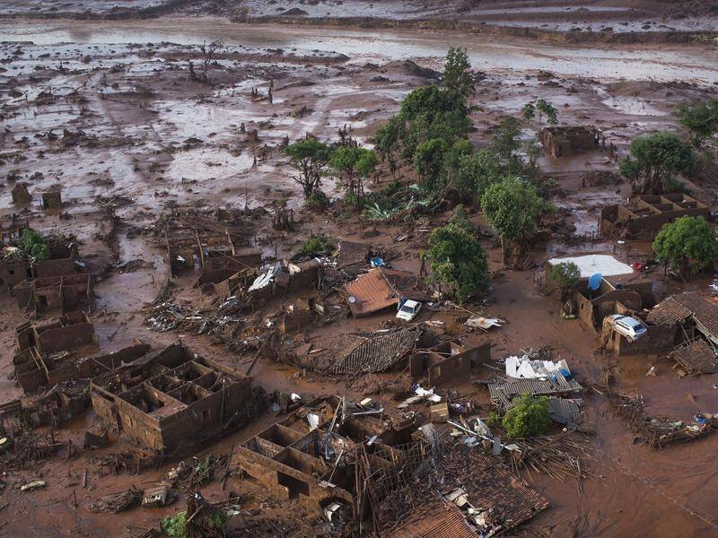 BHP's mining waste dam burst near the town of Mariana, releasing a torrent that killed 19 people.
