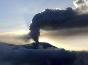 Indonesia's Mount Marapi has erupted for a second day, halting the search for climbers. (AP PHOTO)