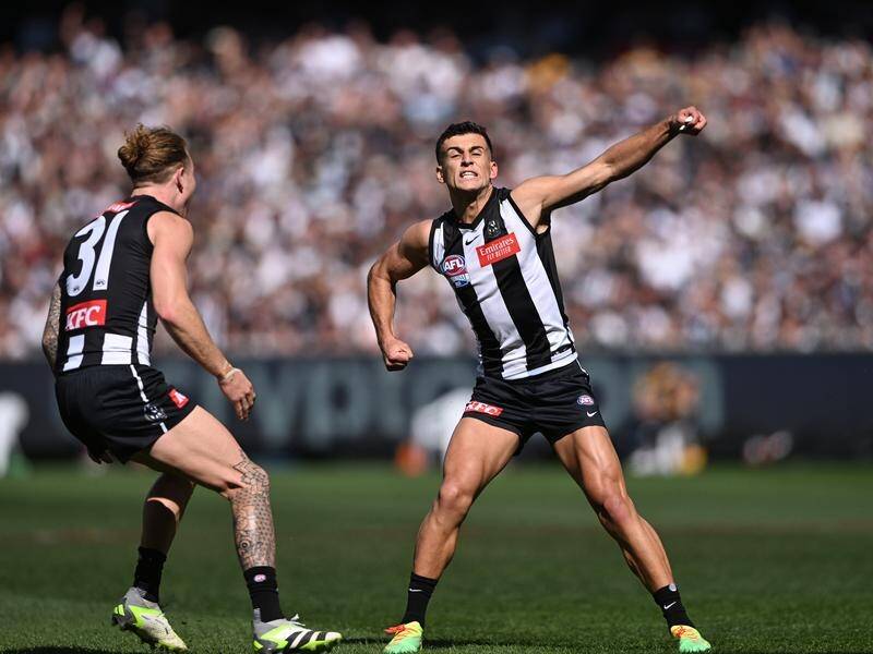 Nick Daicos (right) kicked the first goal of the AFL grand in Collingwood's win over Brisbane. (James Ross/AAP PHOTOS)