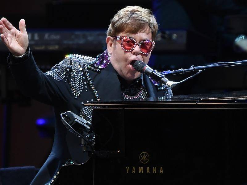 Sir Elton John praised the work of firefighters as he pledged $1m to the bushfires fund.