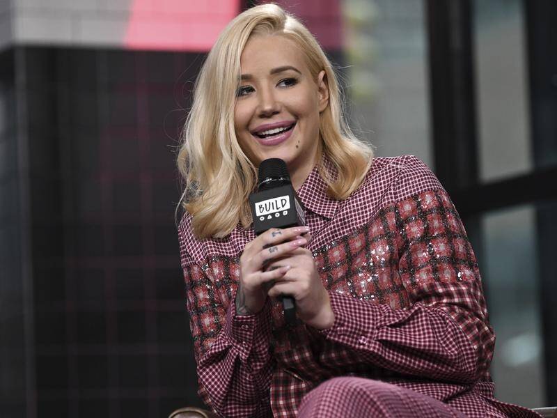 Rapper Iggy Azalea is going back to the studio after signing a new record deal with Empire.