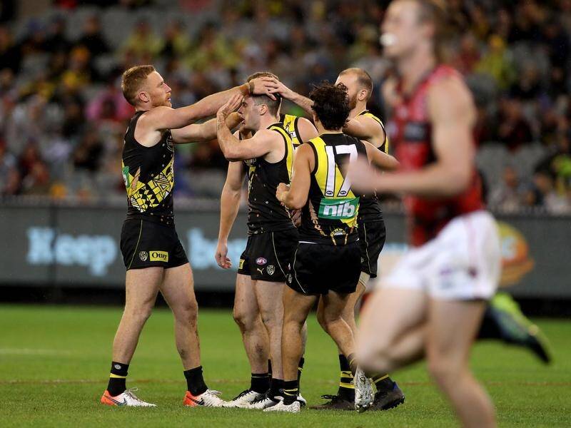 Richmond have weathered an Essendon comeback to win their AFL clash at the MCG by 23 points.