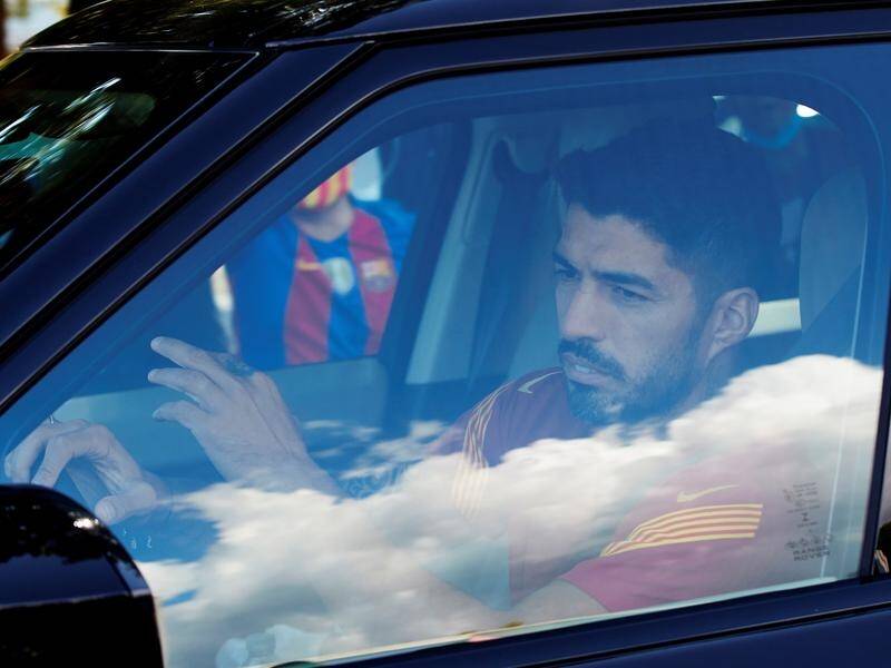 Uruguayan striker Luis Suarez is staying in Spain, signing a deal to play with Atletico Madrid.
