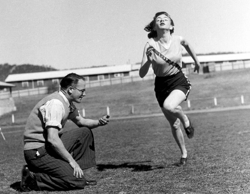 LITHGOW FLASH: Marjorie Jackson-Nelson training for running back in 1950s with Jim Monaghan. PHOTO: Fairfax Media.