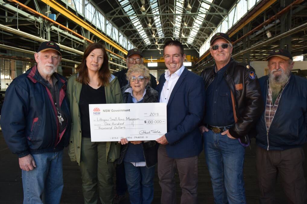 The team at Lithgow Small Arms Factory Museum accepts the big cheque from Bathurst MP Paul Toole on Friday. 
