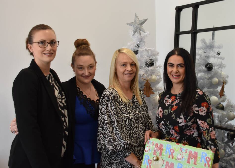 CHRISTMAS SUPPORT: Ray White sales support and property manager Angela Phillips, administration and accounts Bianca Evans, team leader- property manager Leuise Wilson and principal Jaharn Torok. Picture: AMBERLENE BOOTH