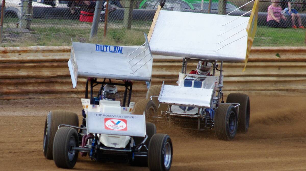 STORM CHASERS: Lance Wilson and Tony Dale impress the spectators with their Vintage Sprintcars at the raceway. Picture: LES TAYLOR.