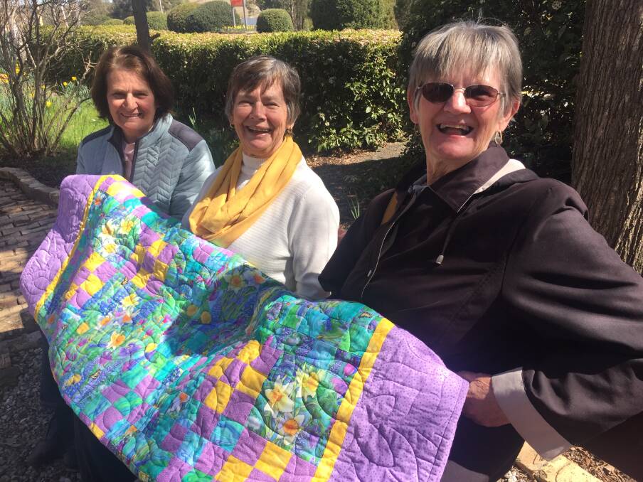 QUILT: Three of the Piggott girls, Jenny McKenzie, Rhonda Kelly, Sandra Haley at the official opening of the Daffodils at Rydal festival on Tuesday. Picture: KIRSTY HORTON. 