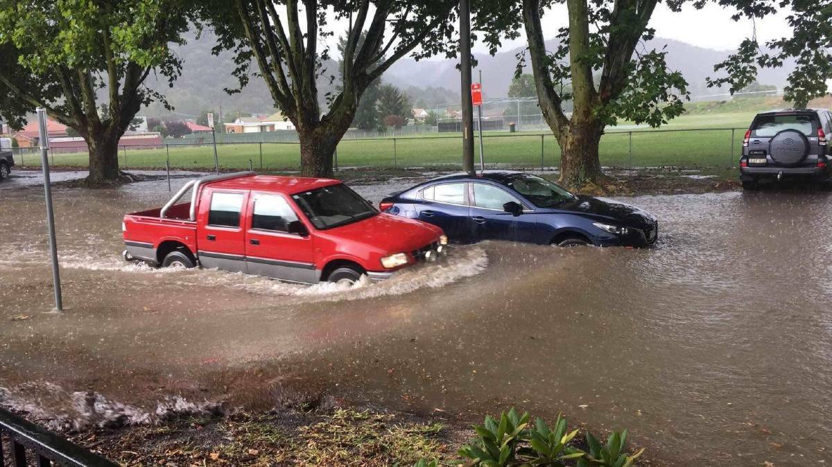 FLOOD: Cars and people became trapped in flood water at the Aquatic Centre. Photo: Greer Ashworth. 