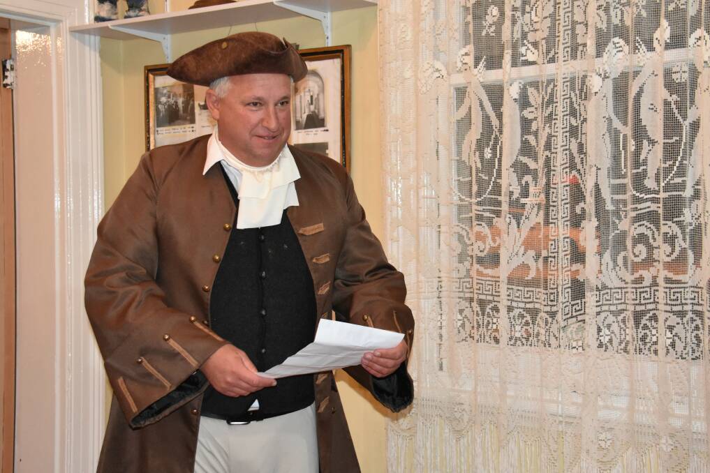 TOWN CRIER: Andrew Toole reads the proclamation of Portland as a town at The Glen Museum on Thursday evening. 