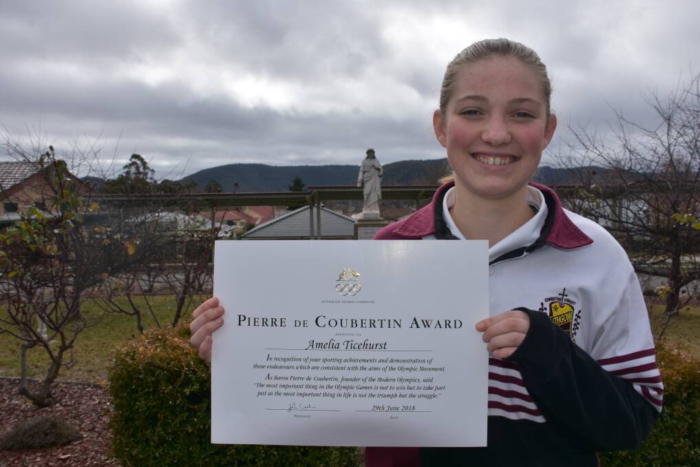 ALL SMILES: Amelia Ticehurst with her honour at La Salle Academy, Lithgow. 