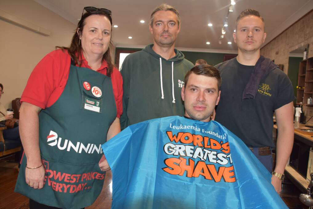 The Bunnings crew with Tim Miller from Tough Grind Barbers. Picture: KIRSTY HORTON. 